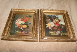 A pair of gilt framed prints of flowers in a Dutch manner,