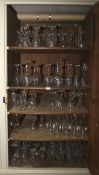 A large quantity of assorted wine glasses, champagne flutes, licquer,