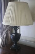 A table lamp in the form of a patinated pineapple topped urn. With pleated silk shade, 60cm high.