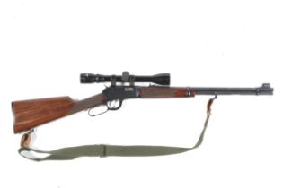 A Winchester underlever .22 magnum rifle.