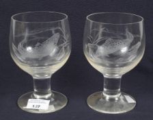 Two Dartington engraved glasses. Carved with a trout and salmon, signed Vivian a Hague 1982.