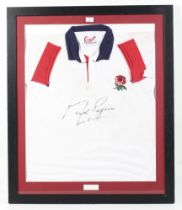 A vintage England rugby shirt signed by Mark Regan (b.1972). Framed and glazed, 95.5cm x 80.
