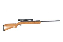 A BSA .22 break barrel air rifle. Complete with scope.