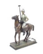 An Austrian Art Deco style novelty table lighter in the form of a polo player on horseback.