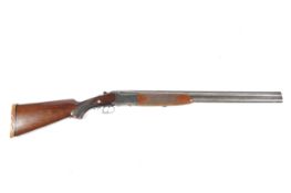 An Ibargun over under double barrelled 12 gauge shotgun. S/N: 84306, 26.