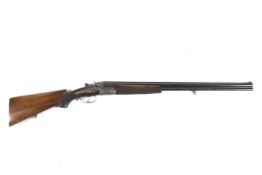 A Boehler combination over and under shotgun. 16 gauge with rifle barrel, 26.