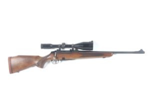 A Tikka M690 bolt action .306 cal rifle. S/N: 879351, with Schmidt and Bender 8x56 scope.