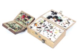 A collection of fly ties and fly tying accessories. In two wooden boxes.