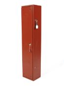 A metal gun cabinet complete with keys. Painted red, H122cm x W26cm x D21cm.