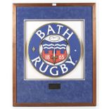 A framed Bath Rugby crest.