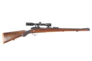 A Mauser 7 x 57mm bolt action rifle.