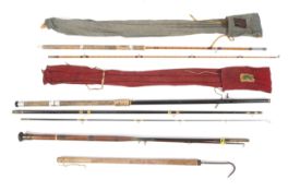 Three vintage fishing rods.