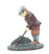 A Cast iron doorstop. In the form of a golfer teeing off, H20cm.