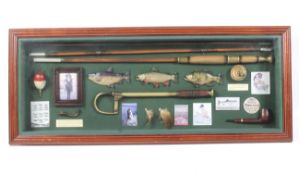 A well presented display board of vintage fishing equipment and ephemera.