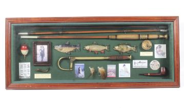 A well presented display board of vintage fishing equipment and ephemera.