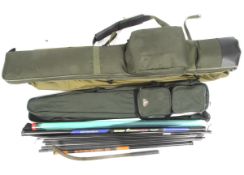 A collection of fishing rods in two rod bags.