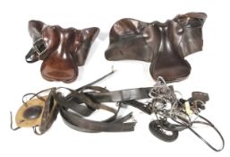 Two leather horse saddles and riding equipment. To include stirrups, etc.