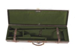 A Gunmark brown leather fitted gun carry case.