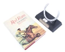 Red Rum Interest: A racing plate and book 'Red Rum' by Ivor Herbert.