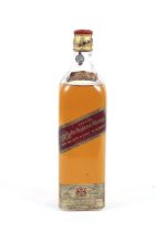 A bottle of Johnnie Walker and Sons Kilmarnock Special Red Label Old Highland Whisky.