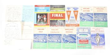 A collection of football programmes.