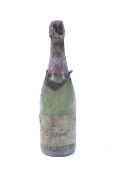 A bottle of Freixenet brut nature champagne 1973. Fill level to neck, no qty or vol shown.