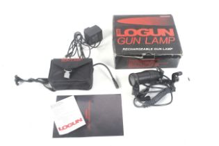 A Logan gun lamp. In original box.