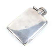 A small silver hip or spirit flask.