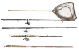 Three fishing rods, reels and a catching net. Noting Daiwa and Browning reels.