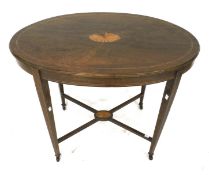 An Edwardian style oval side table with inlay. With square tapering supports on casters.