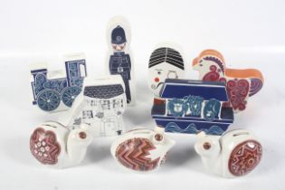 Nine Carlton Ware ceramic money boxes.