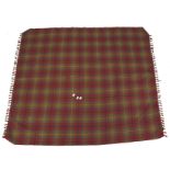 A Mulberry throw in a chequered fabric with tassels to either end.
