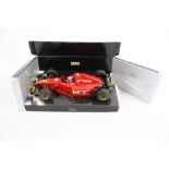 A TFBB (Toys for Big Boys) remote control Porsche and an Onyx Formula 1 model.