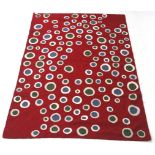 Zaida Kashmir wool textile throw red ground with circles.