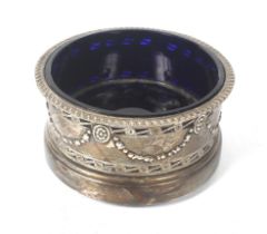 An Edwardian silver salt of circular form.