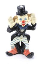 A large clown money box bank figure.