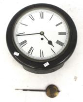 A vintage circular school wall clock.