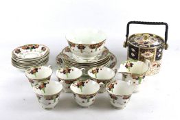 A Royal Staffordshire six piece tea service and an Imari biscuit barrel.