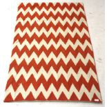 Zaida Kashmir wool textile throw orange and white zig zag.