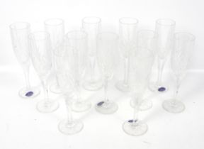 A set of twelve Royal Doulton champagne flutes.