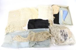 A collection of Victorian and later fabrics and lace.