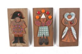 Three Hornsea Muramic handcrafted wall plaques.