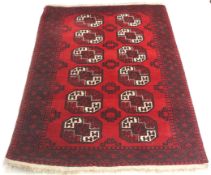 A 20th century woollen blend rug.