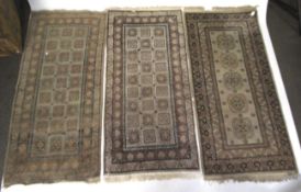 Three similar vintage wool rugs. With geometric patterns.