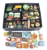 A collection of vintage product advertising tins.