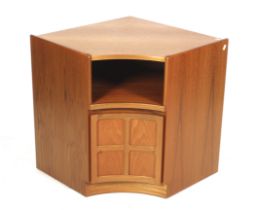 A Nathan teak corner cabinet with convex door and open shelf.