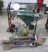 A collection of assorted vintage garden hand tools.