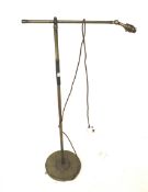 A Mid century brass adjustable standard lamp.
