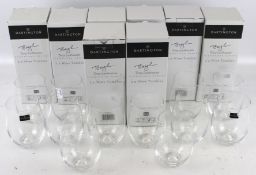 A collection of Dartington wine tumbler glasses.