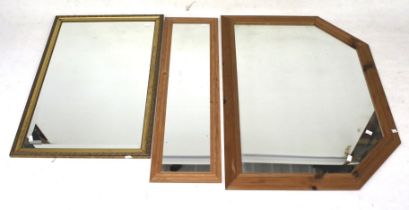 Three contemporary framed wall mirrors.